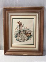 Full view of framed needlepoint artwork