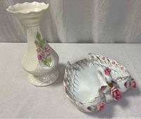Overall view of porcelain bud vase and swan dish