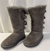 Front and side view of both gray suede UGG boots showing overall condition, suede texture, sole thickness