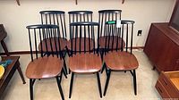 Front view of all six wood dining chairs