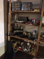 Full shelving unit with assorted hardware supplies and organizers