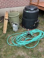 Overall lot with compost bin, hose, tub, watering can, screen