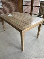 Full view of cedar dining table on porch