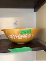 Golden Butterfly Gold Pyrex mixing bowl on shelf