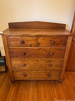 Front view showing all five drawers and back splash