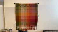 Full view of woven wall hanging on wall