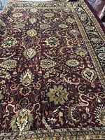 Full view of red/burgundy handmade Tabriz design wool rug