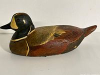 Right profile of wooden duck decoy