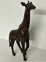 Full view of carved wooden giraffe figurine