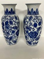 Front view of the two matching blue and white vases