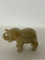 Left side view of soapstone elephant figurine