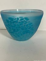 Front view of turquoise Ryukyu glass bowl showing mottled pattern