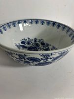 Side view showing exterior blue floral design and shape