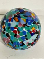Overall view of Murano multicolor confetti glass paperweight