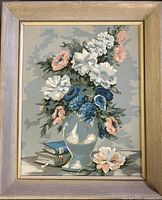 Framed signed floral oil on board painting