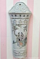 Full view of vase hanging on wall