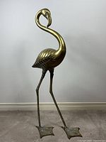 Full view of brass flamingo sculpture