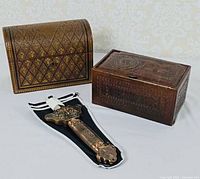 Group shot of sword and two leather boxes