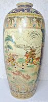 Full view of vase showing front samurai scene and decorative borders