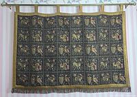 Full front view of tapestry hanging from rod showing entire design and fringe