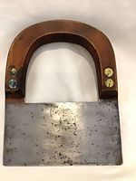 Front view of wood-handle chopper showing blade and fasteners