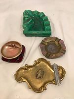 Group shot showing all four ashtrays