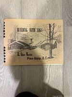 Front cover of spiral-bound manual showing title, author, illustration