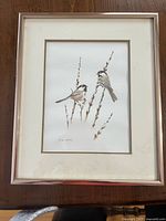 Front view of framed Glen Loates chickadee print showing artwork, mat and frame