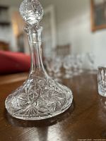Cut crystal decanter with stopper showing pinwheel cuts