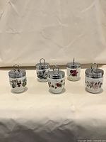 Group view of five Royal Worcester egg coddlers