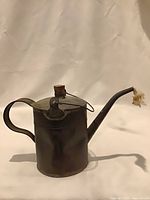 Full view left side showing spout, handle and cork