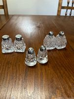 All six shakers grouped on table, showing shapes and caps