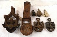 Group shot of all seven pulleys showing styles and condition