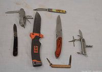 All seven knives laid out showing type and size