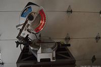 Left profile of Delta miter saw on stand