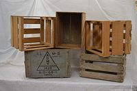Group view of five crates/boxes