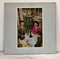 Front of gatefold sleeve showing central image on gray background