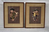 Both framed prints side by side