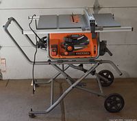 Full view of Ridgid table saw mounted on folding stand