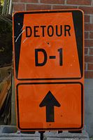Orange Detour D-1 sign with arrow