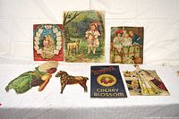 Group shot of all seven ephemera pieces displayed