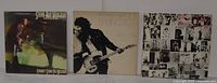 Front covers of three LPs: Stevie Ray Vaughan, Bruce Springsteen, Rolling Stones