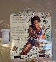 Full view of autographed 16"x20" poster with glasses for scale