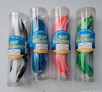 Four goggles in tubes, colours visible