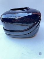 Full view of navy blue crackle-glaze ceramic vase