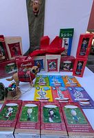 Overall lot showing boxed ornaments, dog pulling sled, moose stocking