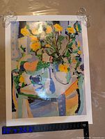 Full view of signed numbered print on surface