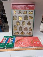 Full lot showing boxed ornaments, tinsel packs, wrapping paper packs