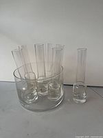 Group shot of seven flutes inside clear ice bucket