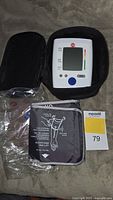 Monitor, cuff in plastic, storage case with lot tag visible